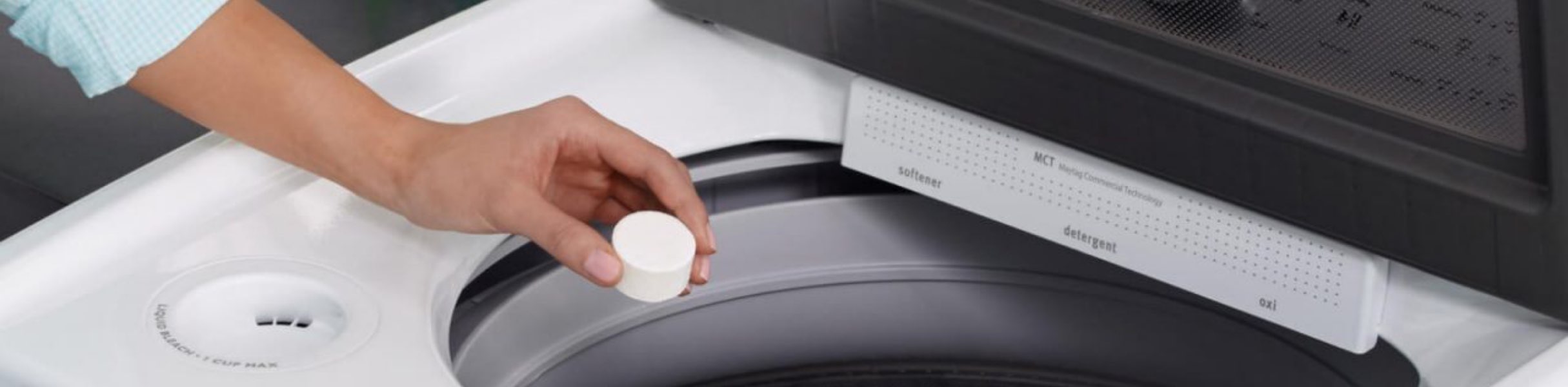 Woman cleaning Maytag Washing Machine