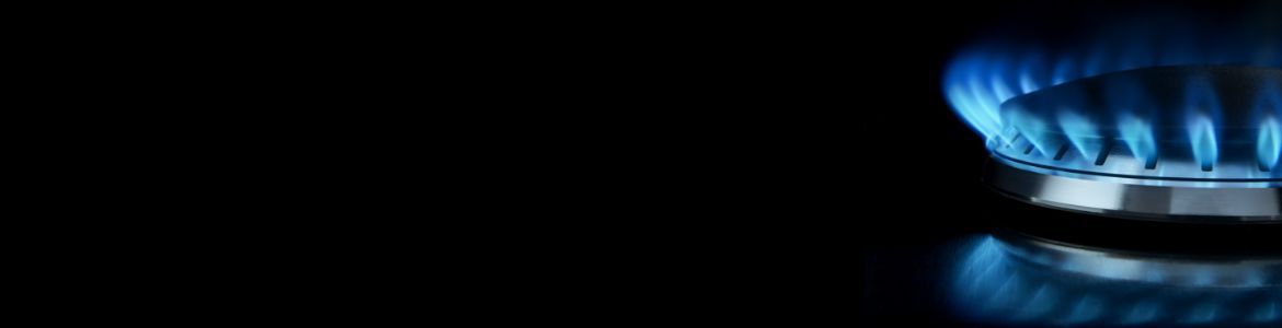 A close-up image of a gas burner with a blue flame.