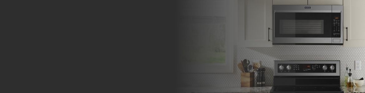 A modern kitchen featuring various Maytag appliances.