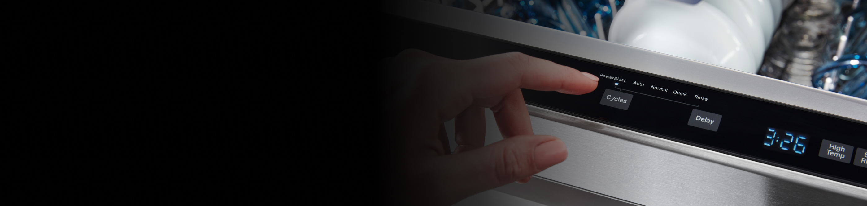 Person selecting cycle on a dishwasher.