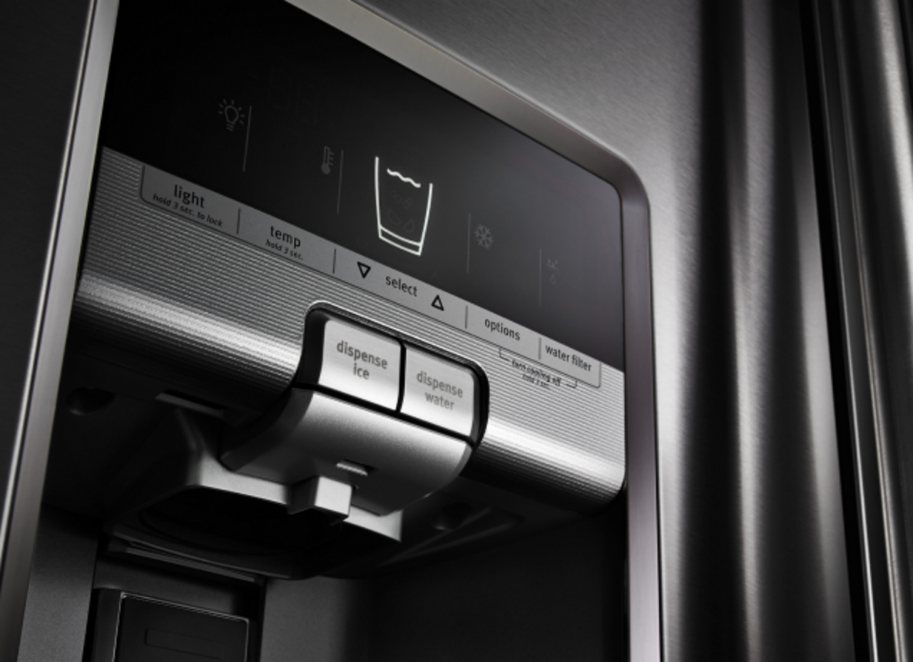 A close-up of a refrigerator ice and water dispenser.