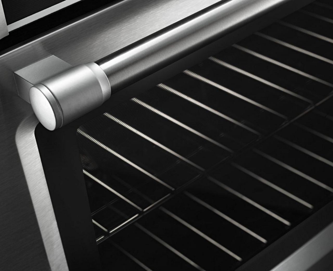 Two oven racks as seen through a glass oven door.