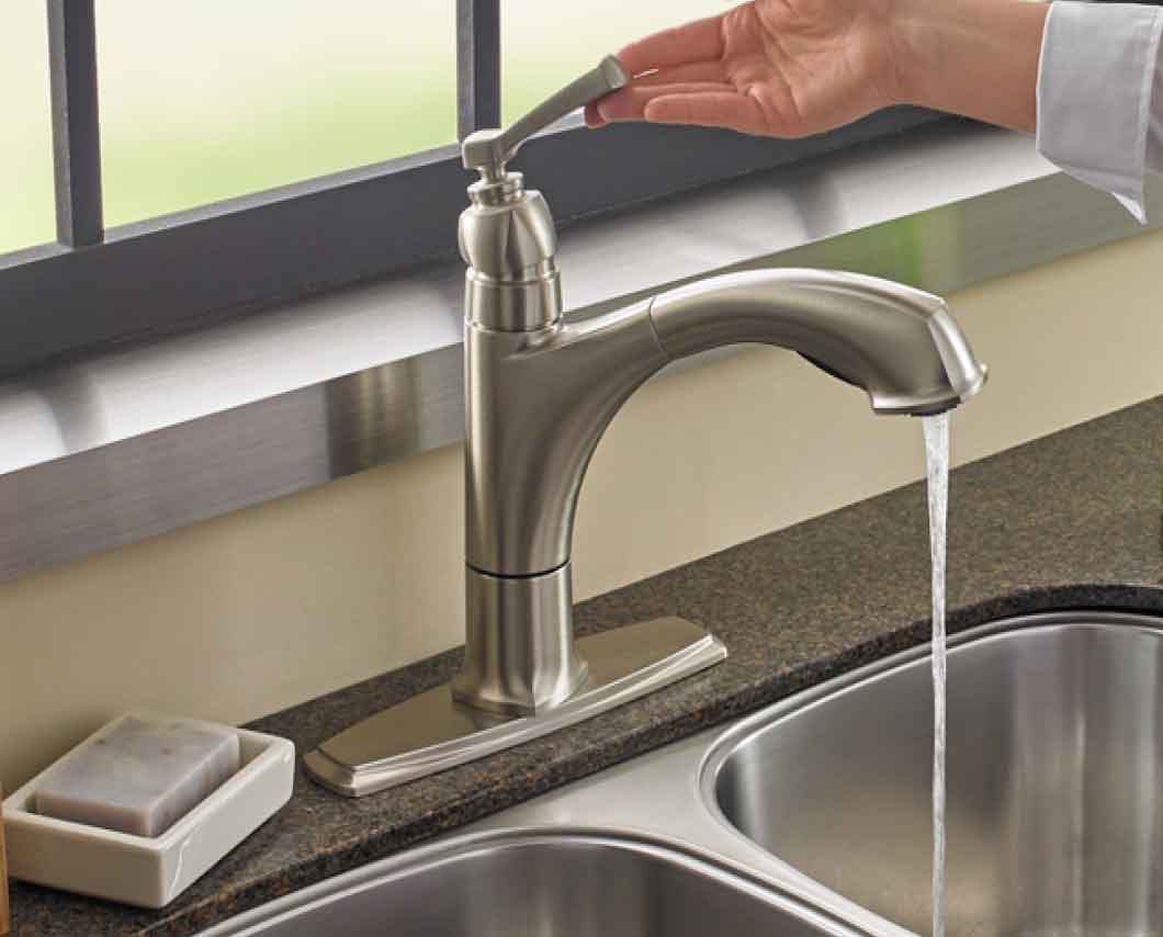 A person turning on a faucet to clean a dishwasher filter. A person turning on a faucet to clean a dishwasher filter.