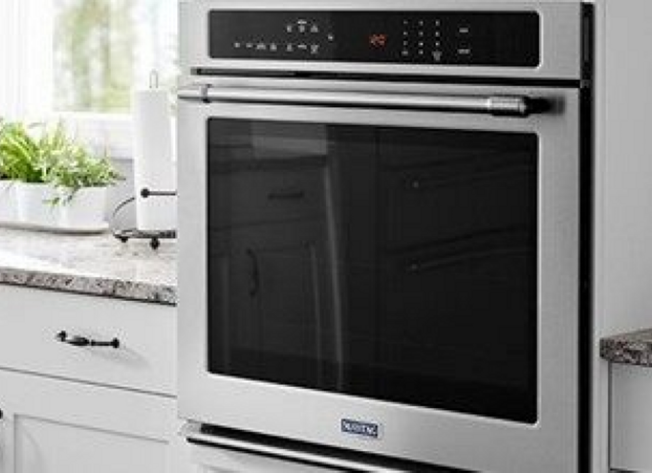 A Maytag wall oven in a kitchen.