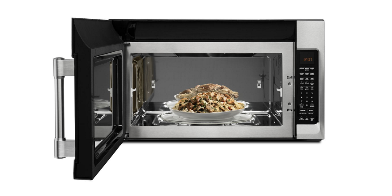 A bowl of food sits inside a Maytag convection microwave. A bowl of food sits inside a Maytag convection microwave.