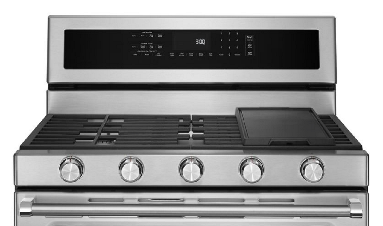 The top portion of a dual fuel range featuring a gas cooktop. The top portion of a dual fuel range featuring a gas cooktop.