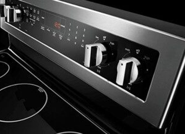 Control knobs for an electric cooktop.