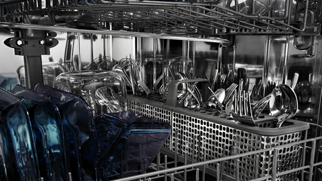 Loaded dishwasher with clear, dry dishes and silverware. Loaded dishwasher with clear, dry dishes and silverware.