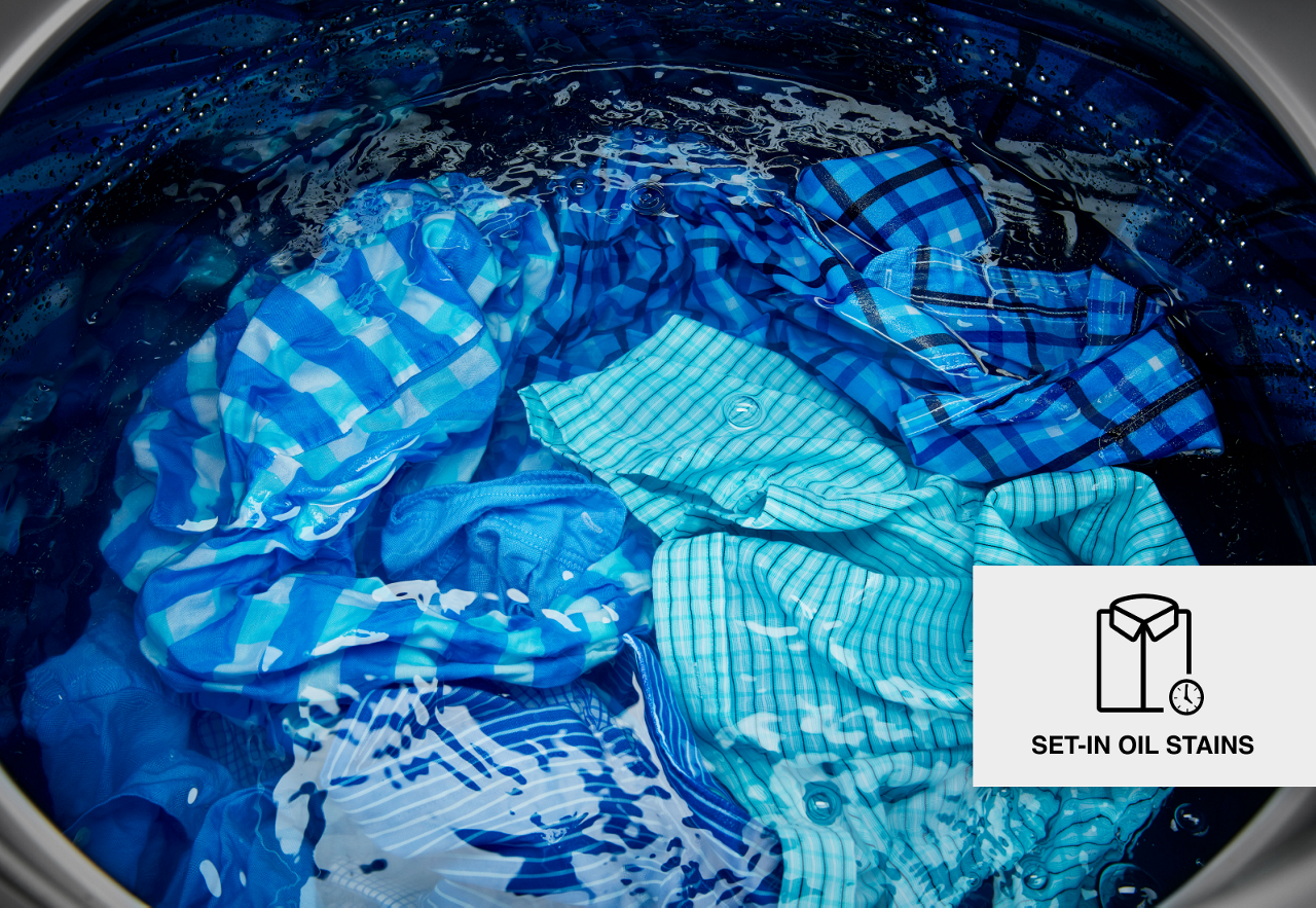 Shirts soaking in the washer. Shirts soaking in the washer.