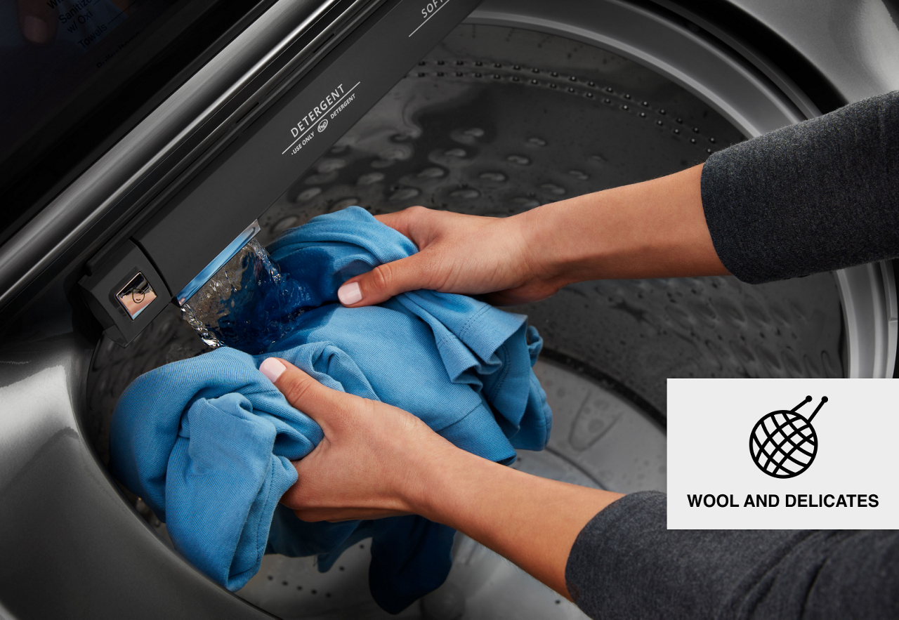 Rinsing clothes in the built-in water faucet. 