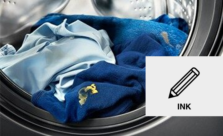 Image of stained clothes in a washer Image of stained clothes in a washer
