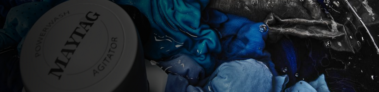 Clothes soaking in a Maytag® washing machine.