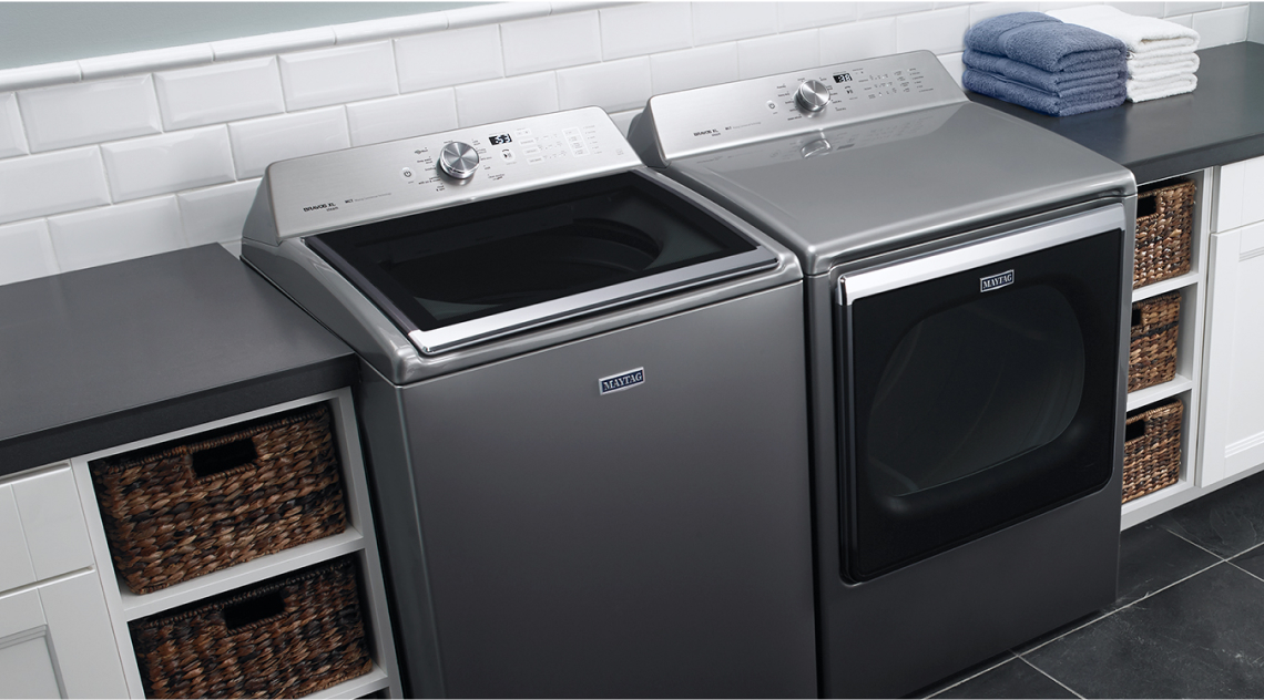 Top load laundry pair in a laundry room Top load laundry pair in a laundry room