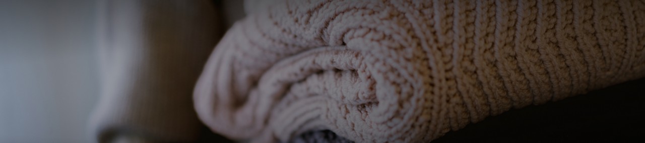 Close-up of a white knit blanket.