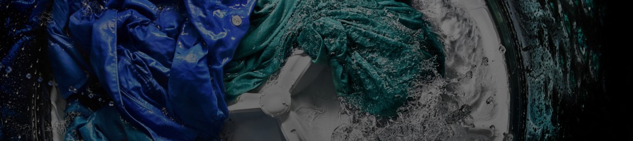 A Maytag® washer rinsing clothes.