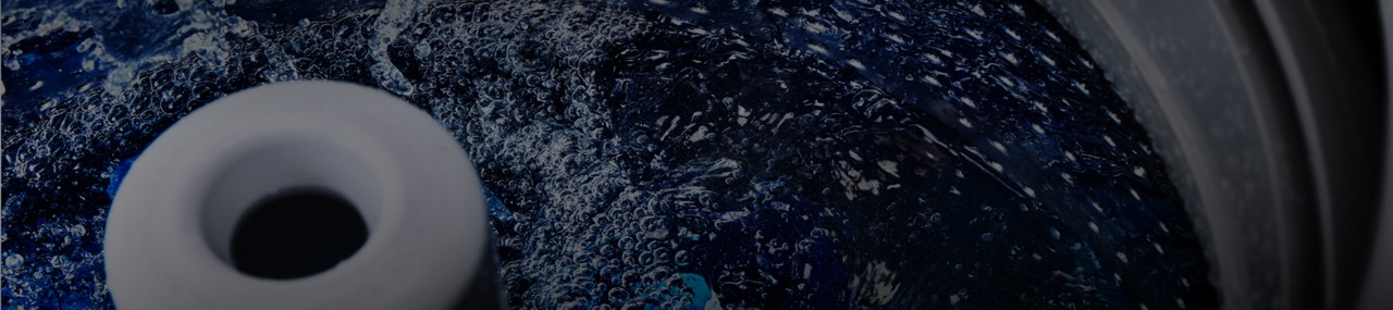 Maytag® top-load washer filled with hot water.