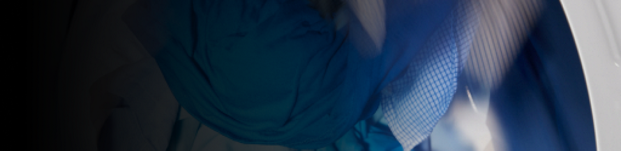 Clothes tumbling in a dryer.