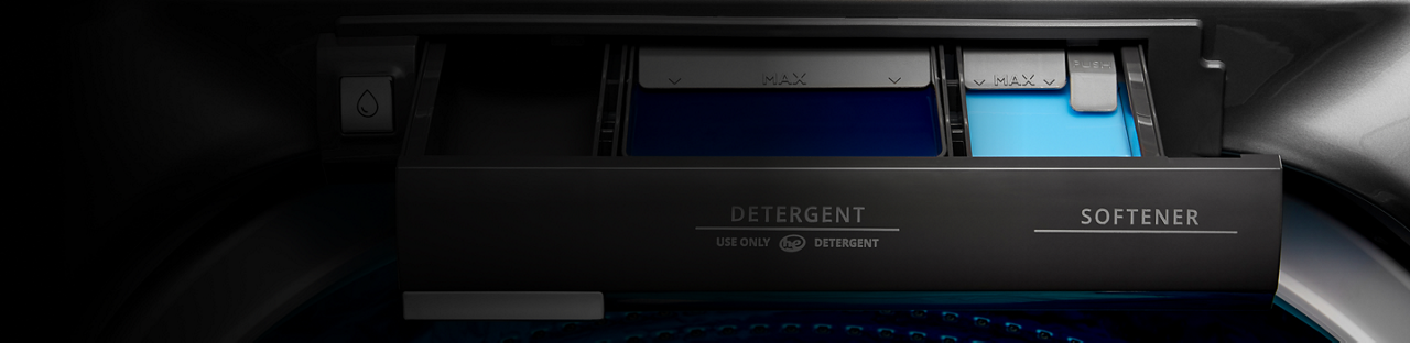 Detergent dispenser and fabric softener dispenser in a washing machine.