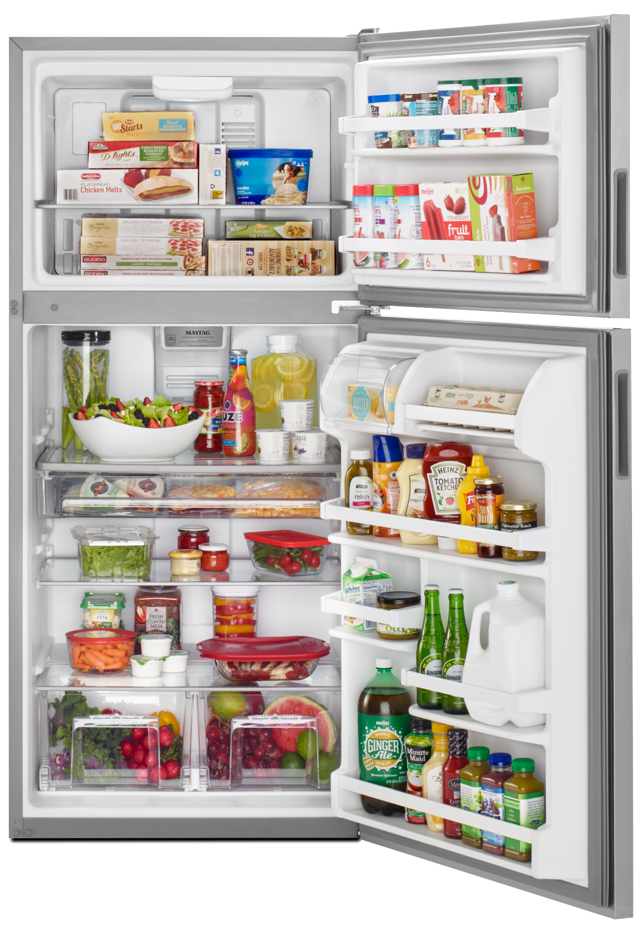 Top-freezer refrigerator stocked with food Top-freezer refrigerator stocked with food