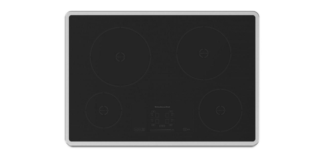 A black induction cooktop with stainless steel trim. A black induction cooktop with stainless steel trim.