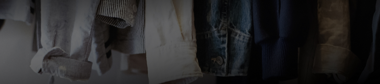 Shirts hanging in a laundry room